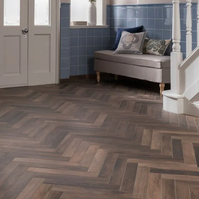 Entrance hall with blue walls and wooden arrow floor