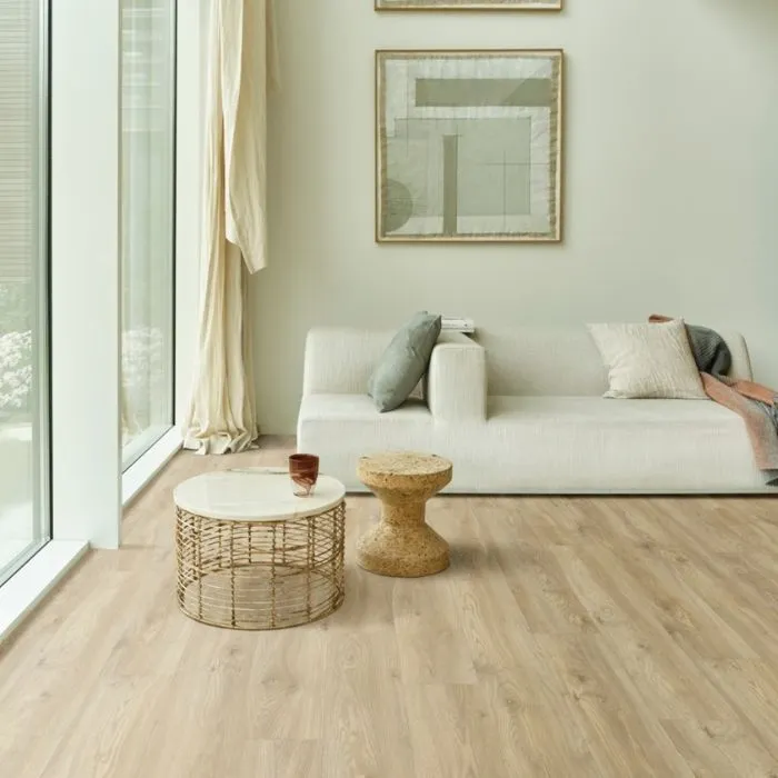 Living room set with white pieces and classic wood style vinyl floors