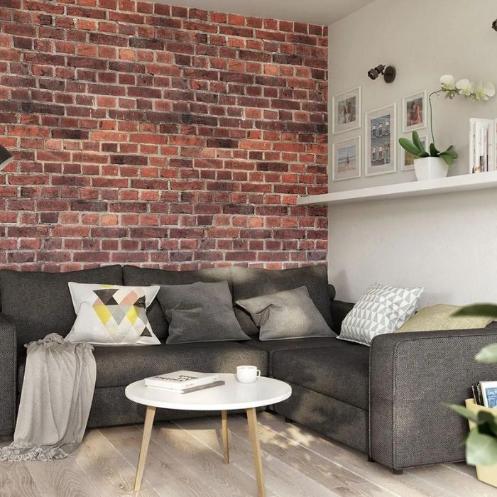 Cosy living room featuring a vibrant red brick wall