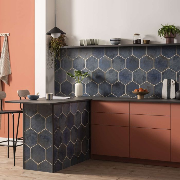 Kitchen with dark blue hexagon tiles