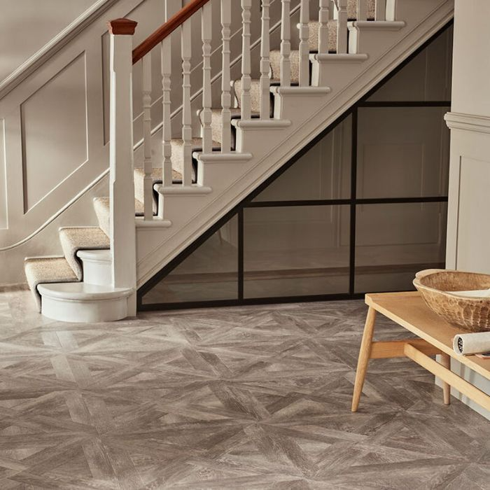 Hallway featuring stairs and rustic bench, tiled flooring