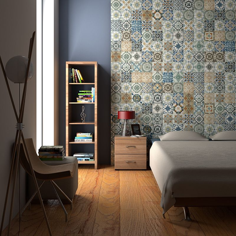 A bedroom with a feature wall of an intricate mosaic of vibrant Moroccan tiles