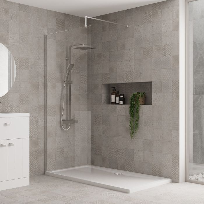 Sophisticated walk-in shower with glass walls in grey tiled bathroom