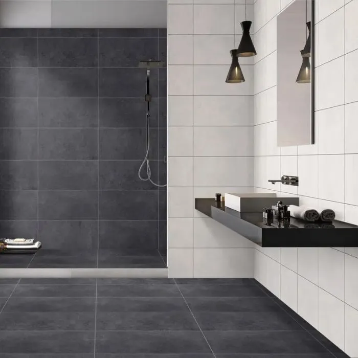 Monochrome bathroom with contrasting black and white tiled floor