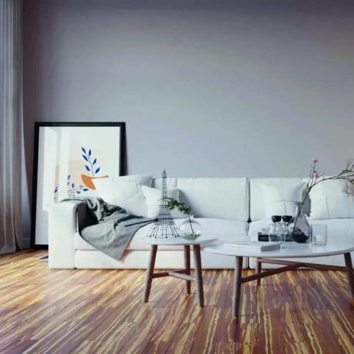 Living room ensemble featuring white furniture and a charming wooden floor design with bamboo accents