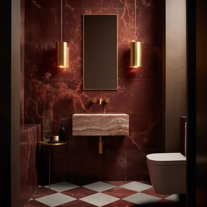 Bold red marble walls and sophisticated gold fixtures in a modern bathroom setting