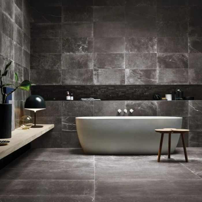 Stylish bathroom design featuring black tiles and grey accents