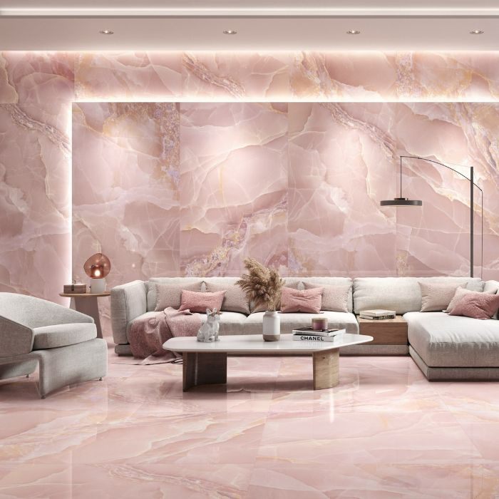 Cozy seating arranged against stunning pink marble walls, adding a touch of luxury