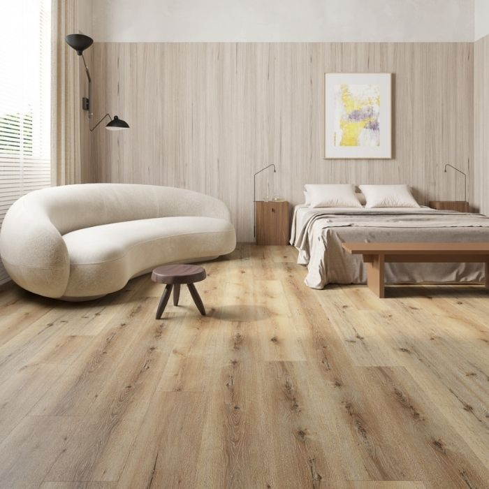 Charming bedroom design with rich wood flooring complemented by a fresh white bedspread