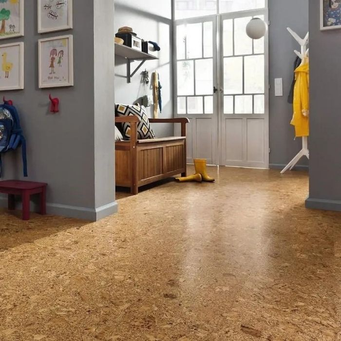 Entryway with cork flooring and wooden bench