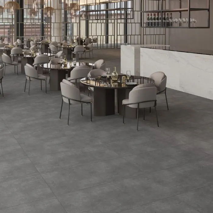 Spacious dining hall with elegant tables and anthracite flooring