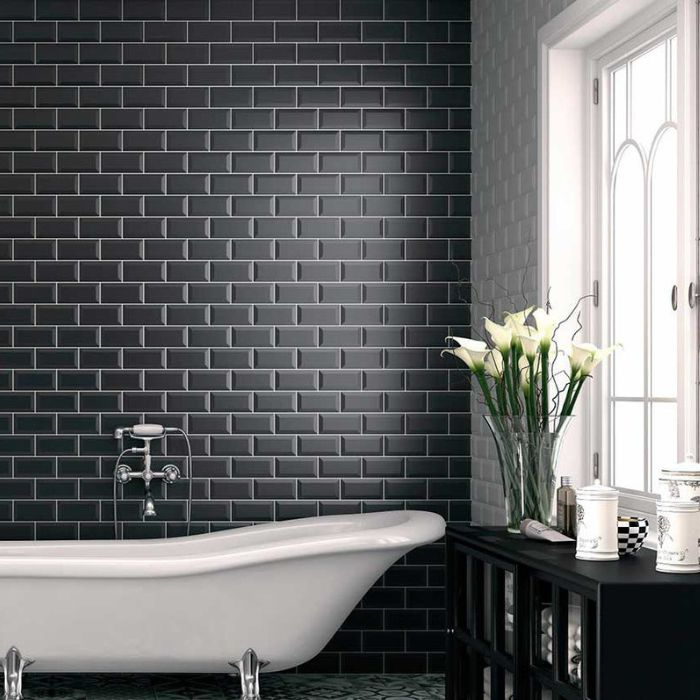 Monochrome bathroom with a metro-tiled wall