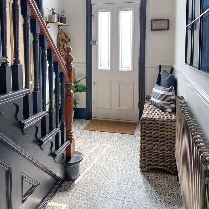 Elegant hallway contrasted with wicker furnishings on ornate flooring