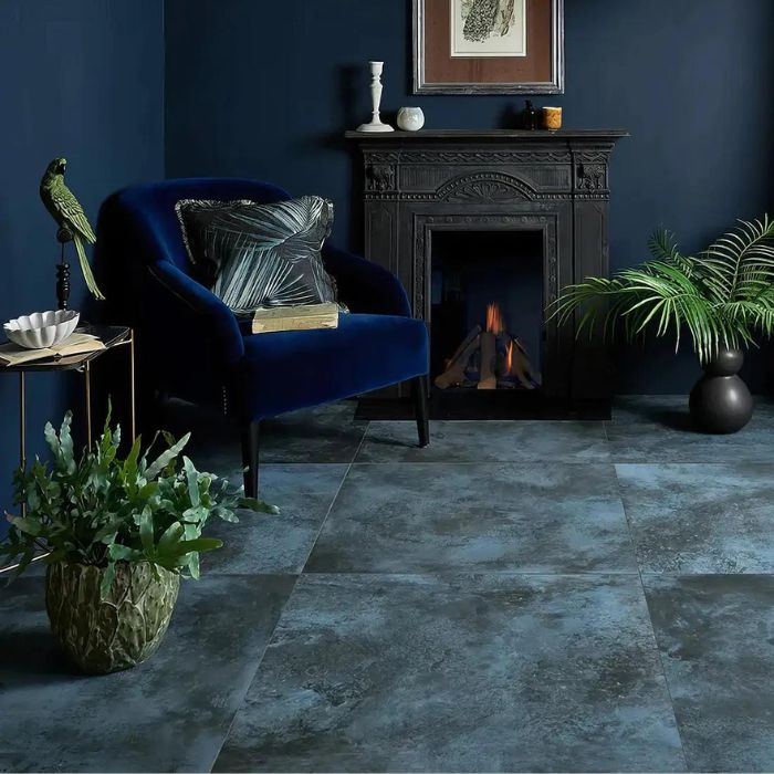 Living room interior featuring a striking blue metal-effect floors and a fireplace