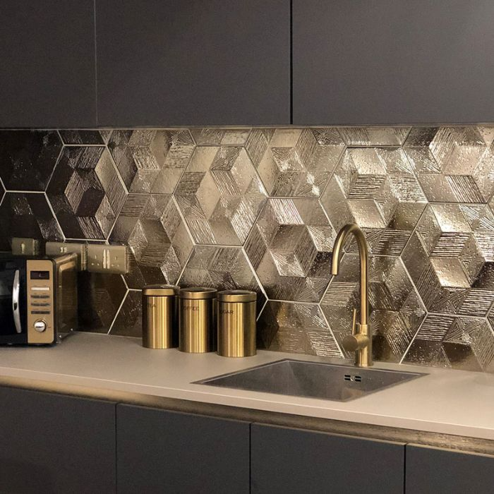 Sophisticated kitchen aesthetic highlighted by golden hexagon backsplash