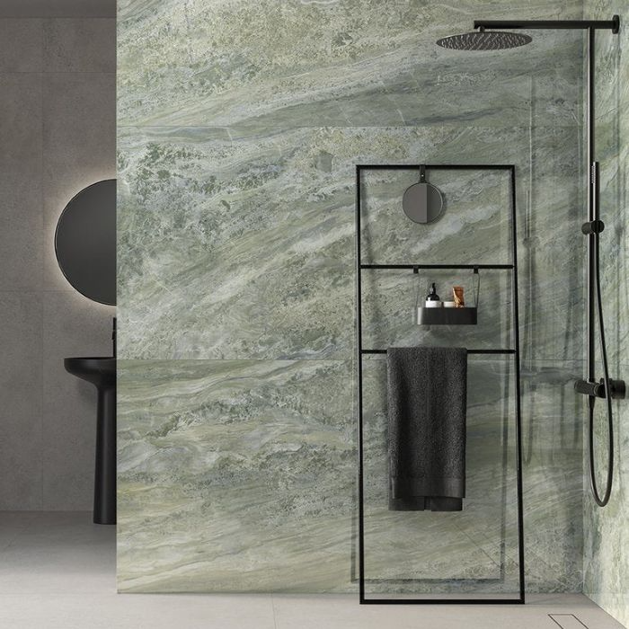 Elegant green marble wall tiles transform this wet room into a luxury oasis