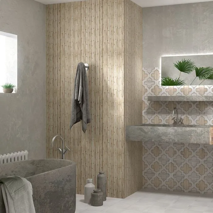 Bathroom setting with a white bathtub and neutral beige walls