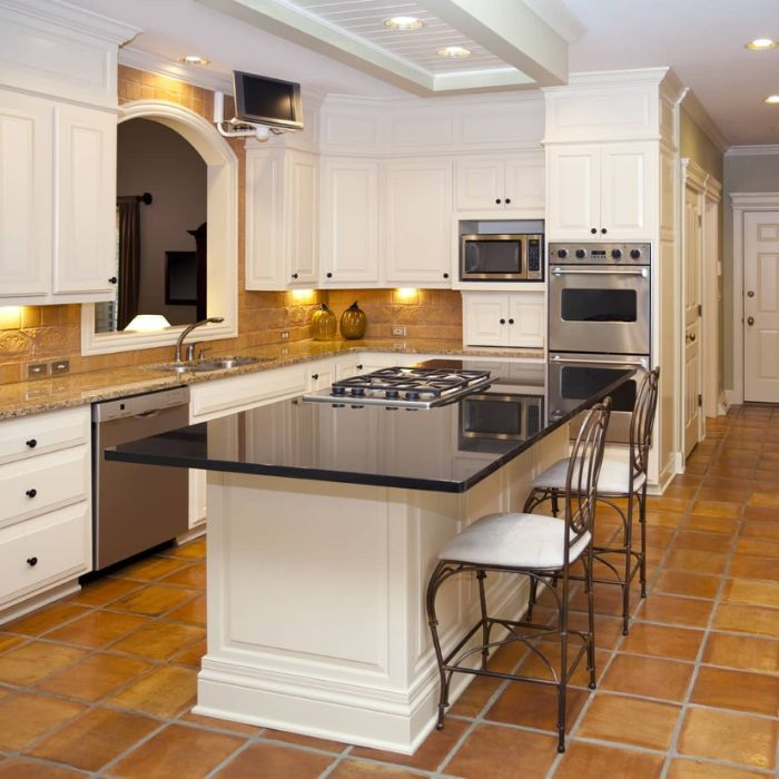 Stunning kitchen with rustic terracotta flooring