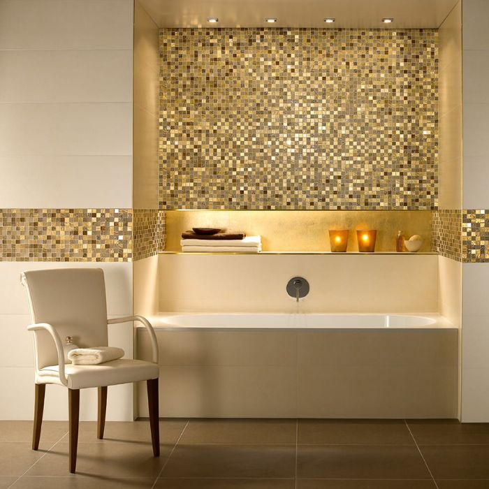 A luxurious bathroom featuring a stunning gold mosaic tiled wall