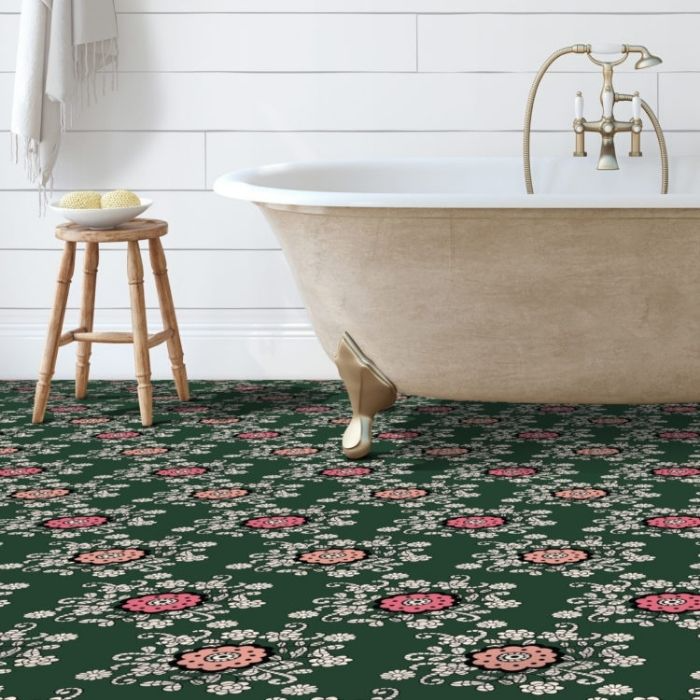 A bathroom showcasing green and pink floral-patterned vinyl flooring 