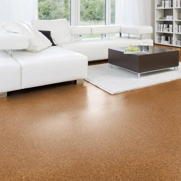 Bright living room with cork flooring and white furniture