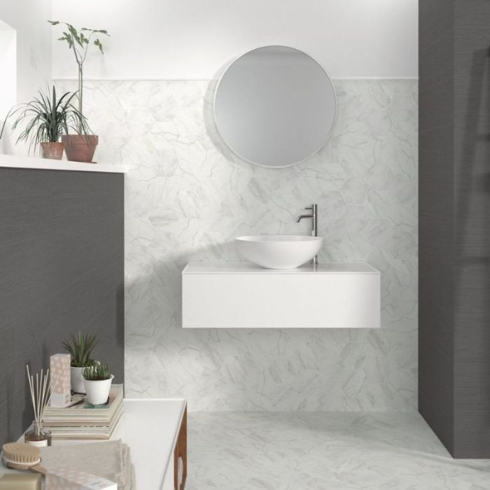 Modern bathroom design with pristine white patterned tiles