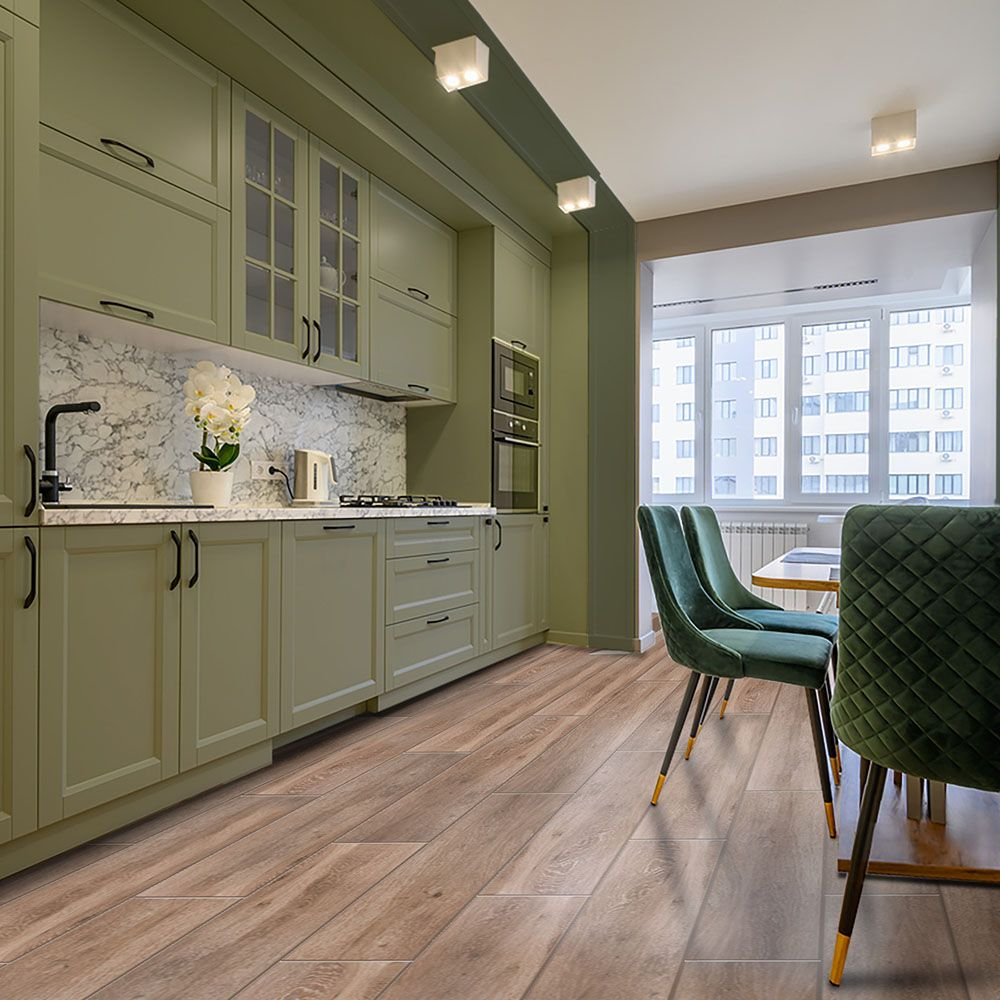 Green cabinetry enhancing wooden floored kitchen