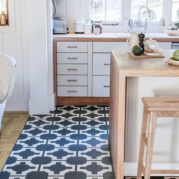 Sleek black and white kitchen design with vinyl tiles