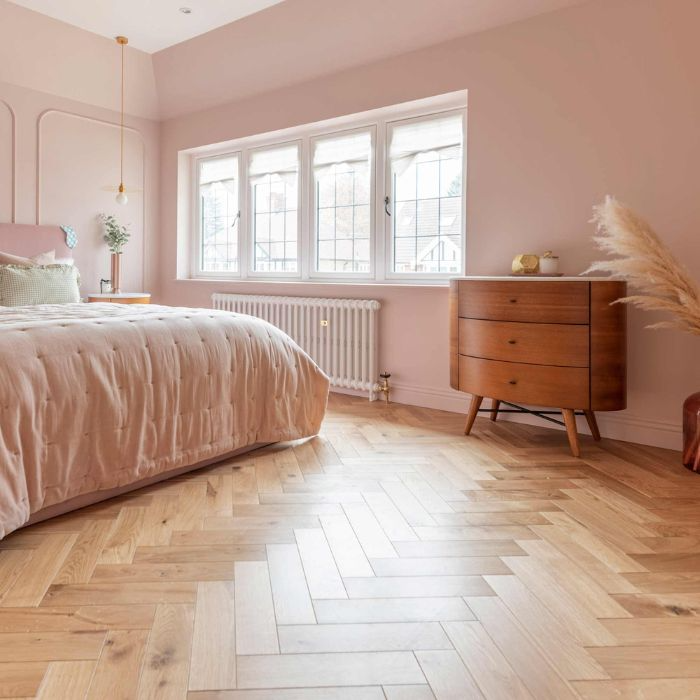 Elegant bedroom with herringbone tiles in neutral tones