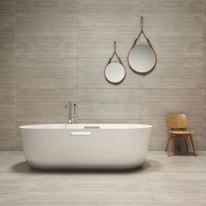 Minimalist bathroom featuring bamboo details on stone wall