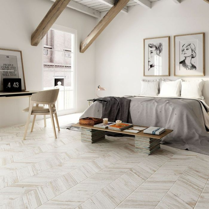 Serene bedroom featuring wooden beams and flooring