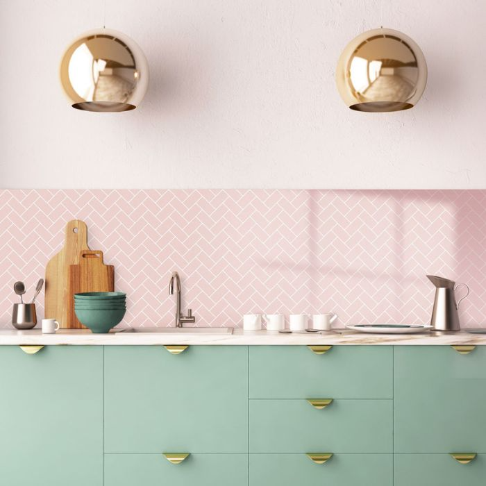 Pink herringbone splashback in a chic, modern kitchen