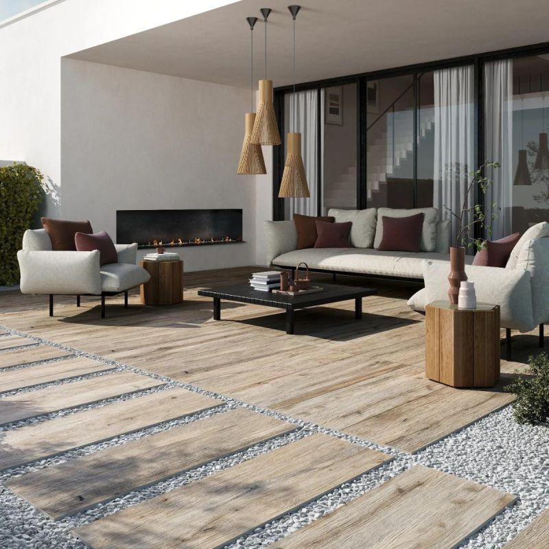 Wooden furniture and a fire pit on a well-designed patio with tiled flooring