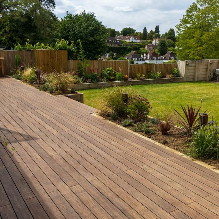 A serene backyard wooden deck featuring bamboo tiles