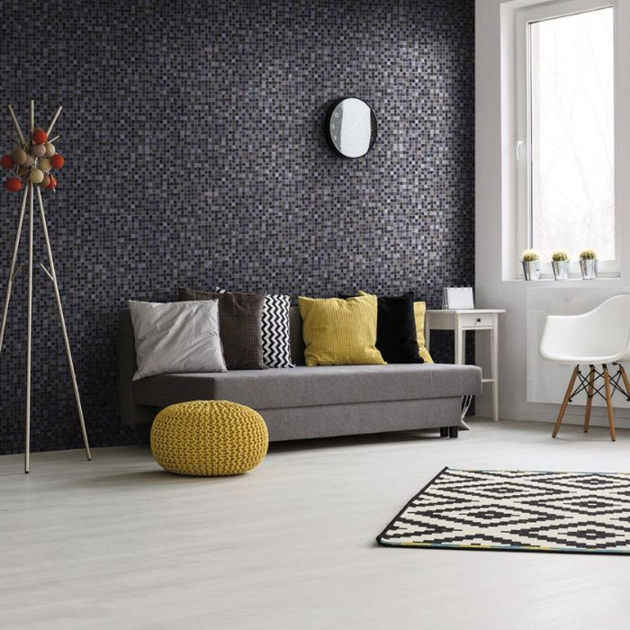 Elegant living room in black and white, highlighted by sunny yellow accents and an intricate mosaic tiled wall