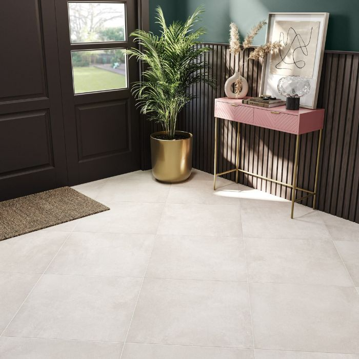 Clean and modern entryway showcasing shiny white tiles paired with a dark walla colours