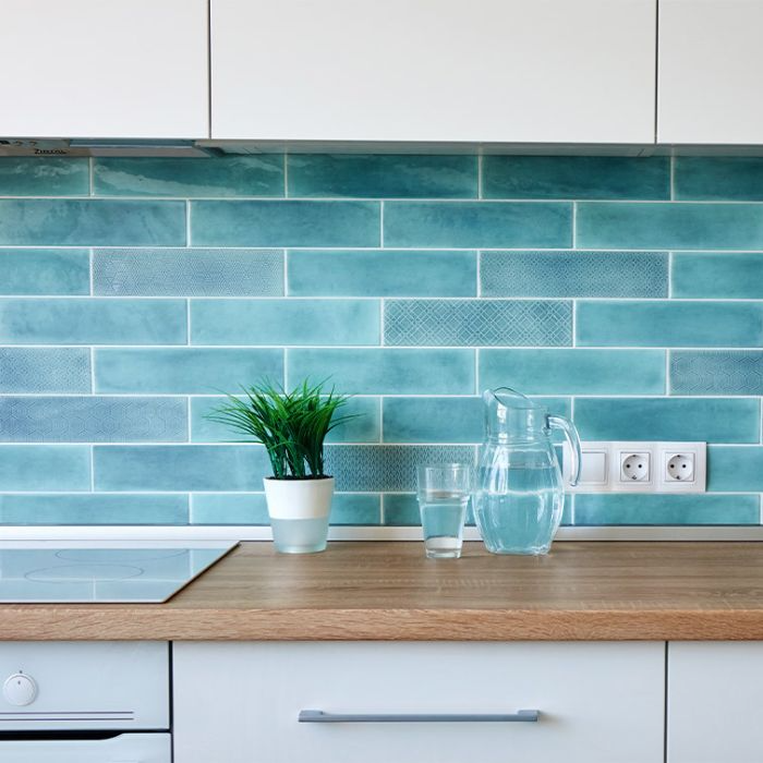 Bright blue tile splashback in a modern kitchen