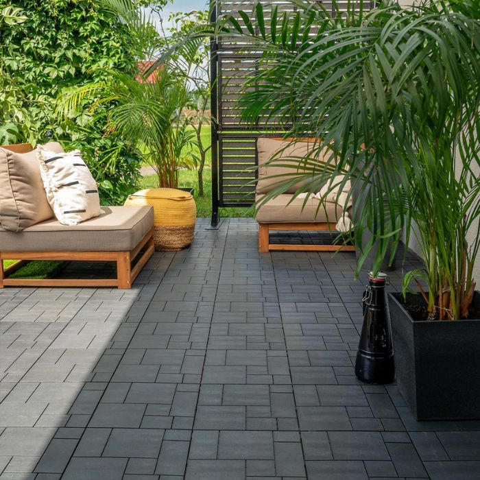 Serene outdoor space with dark tile flooring