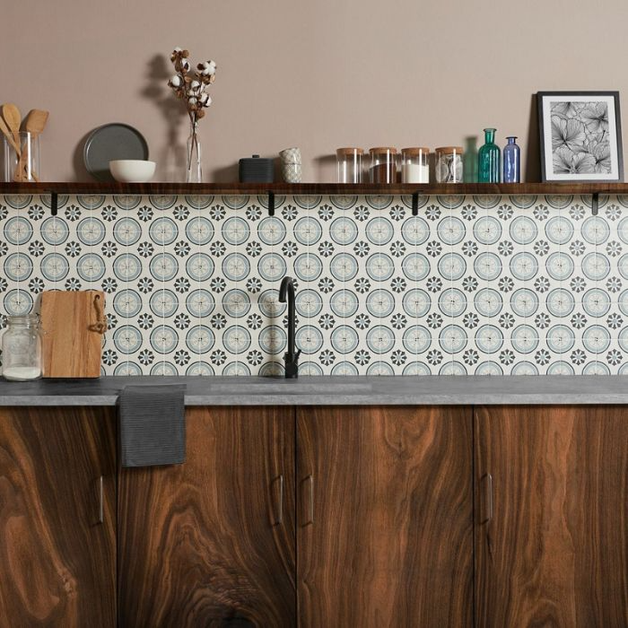 Wooden kitchen counter with patterned tiled backsplash