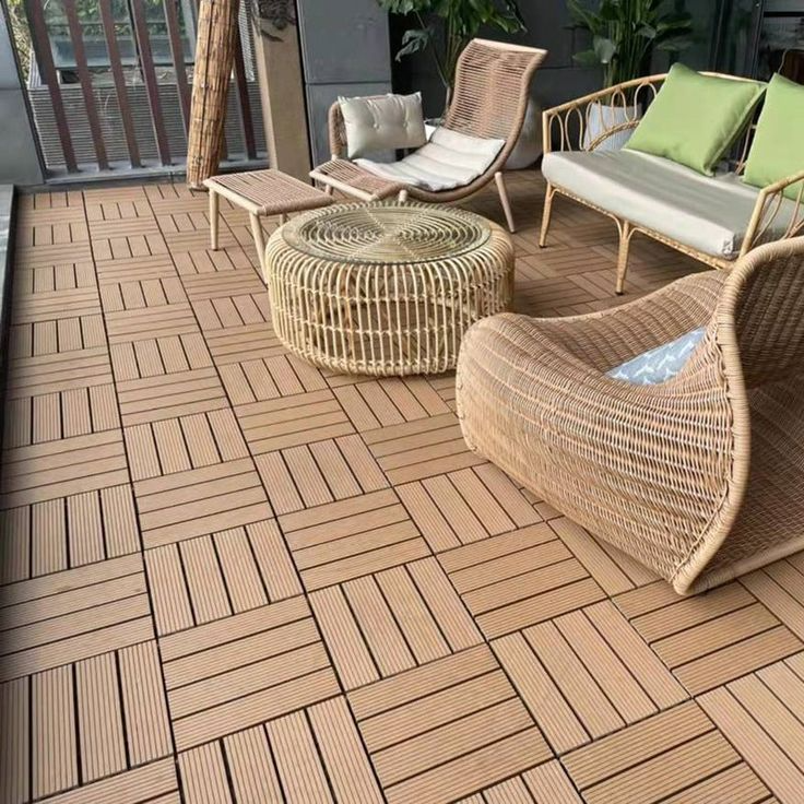 Inviting wooden deck with stylish wicker furniture and chairs