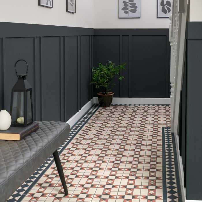 Hallway featuring a patterned tiled floor and a simple wooden bench along one side