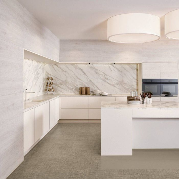 Bright white kitchen with luxurious marble surfaces