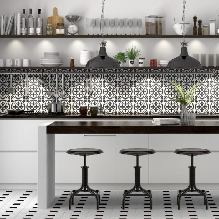 Stylish black and white tiled kitchen with trendy seating