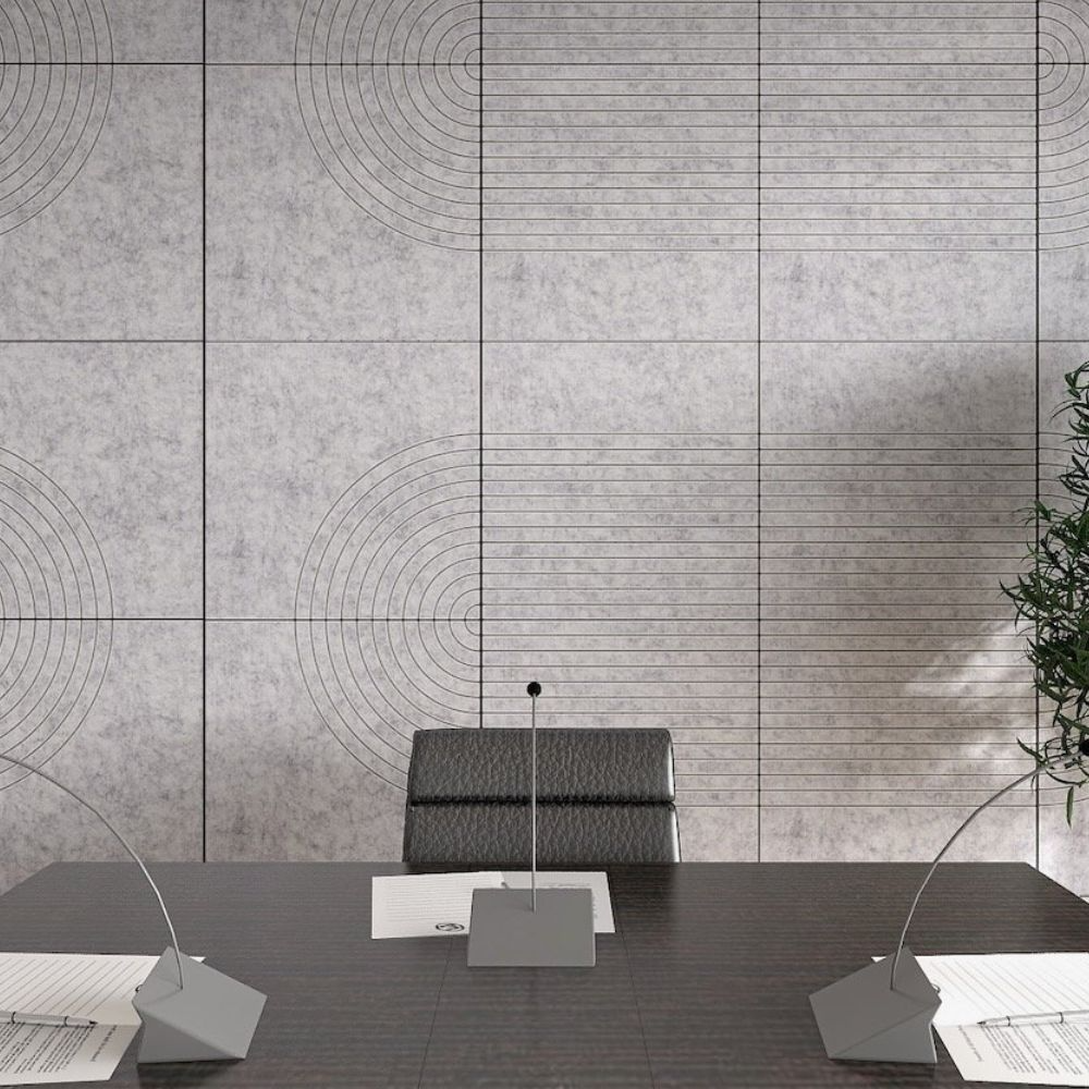 a conference room with grey acoustic wall tiles