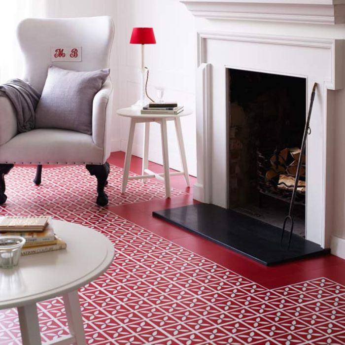 Inviting living space with striking red tiling and a fireplace