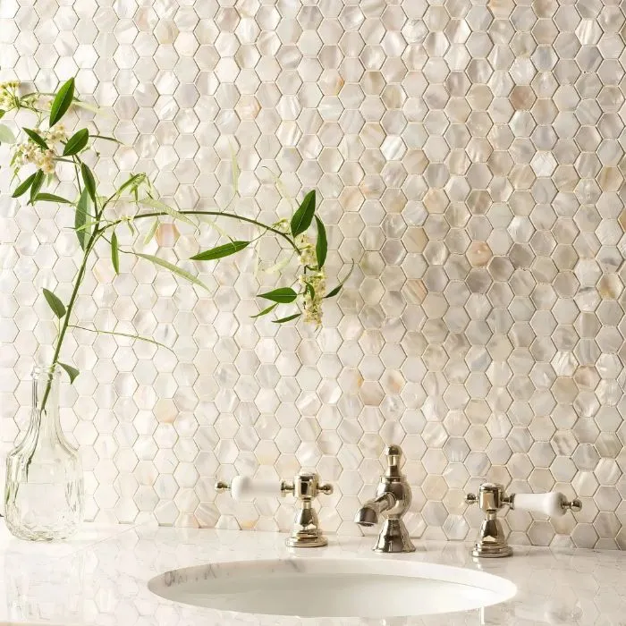 Elegant bathroom with shimmering white pearl mosaic tiles