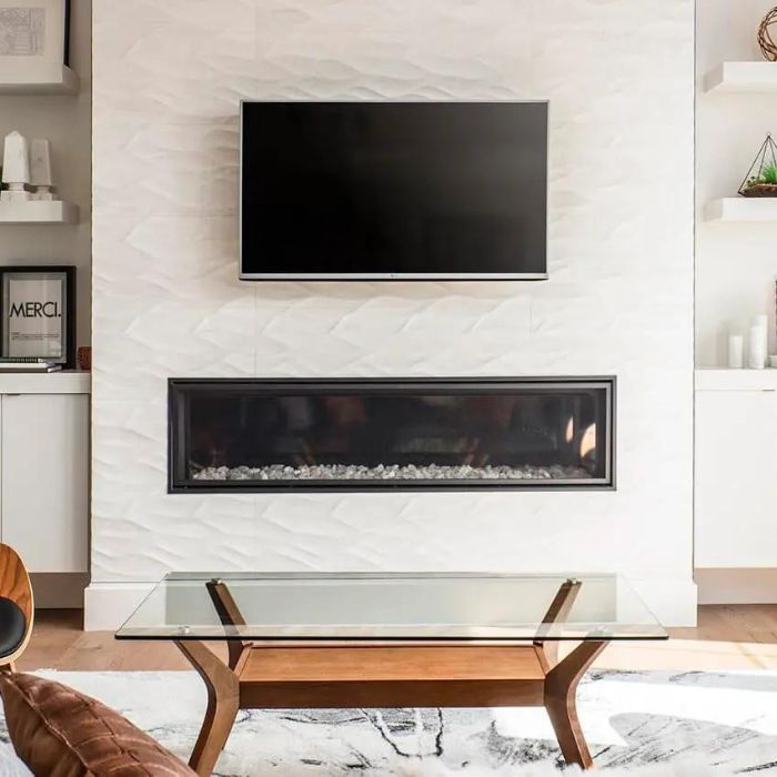 A modern living room featuring a stylish fireplace and a sleek TV