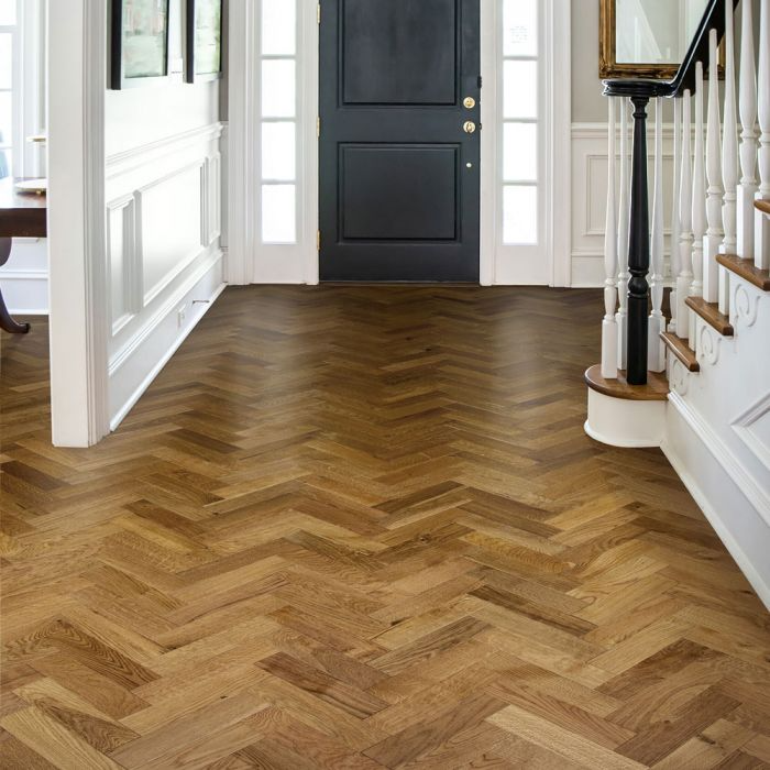 Chic hallway design with herringbone hardwood flooring