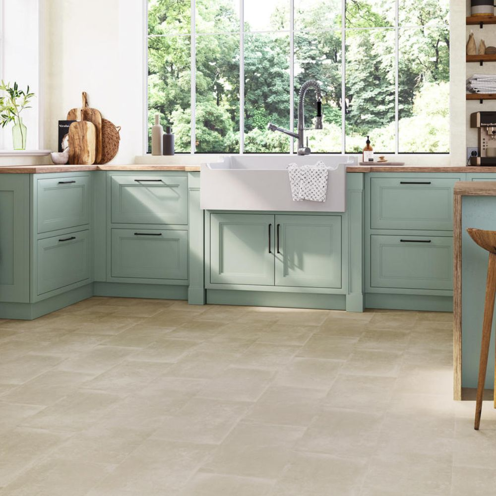 muted mint green kitchen with neutral vinyl tile flooring