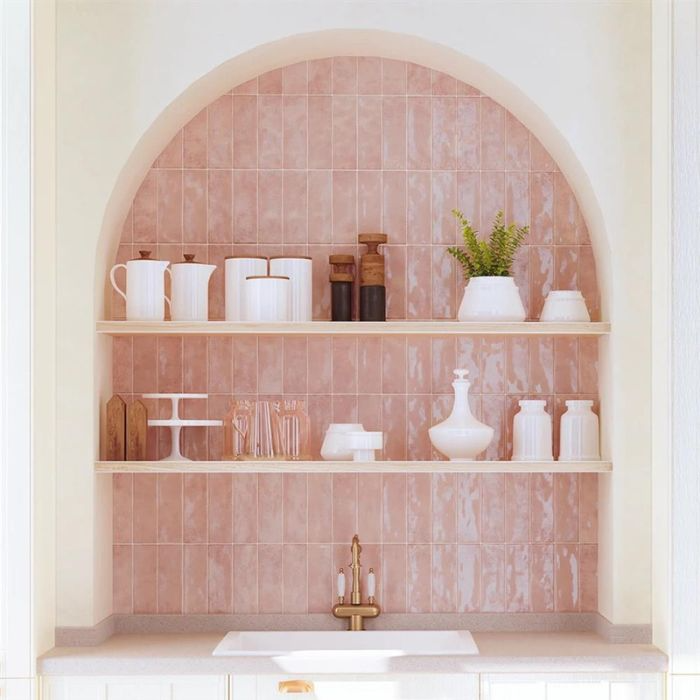 Pink metro tiled shelves with a sink in a vibrant setting